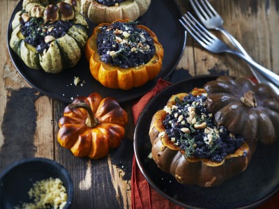 Squash stuffed with creamy squid ink risotto, Beaufort and hazelnuts